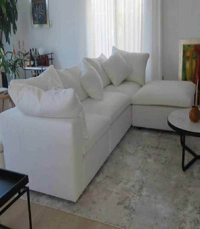 Comfortable white Foam Cloud Modular Sectional Sofa arranged in an L-shape in a bright living room